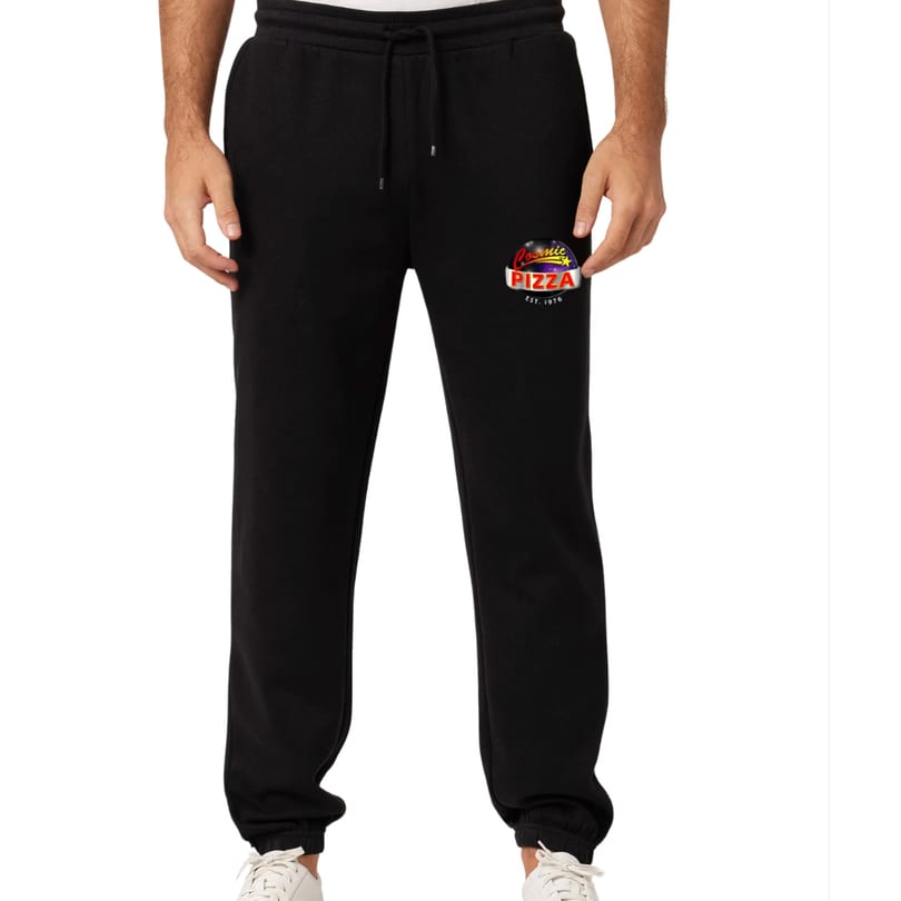 Black sweatpants with the Cosmic Pizza logo on the left thigh, worn by a person.