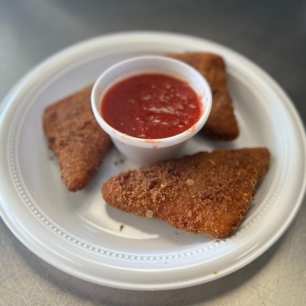 Three crispy fried mozzarella sticks with a side of marinara sauce on a white plate.